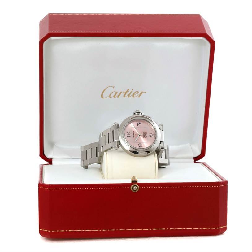 The Cartier Pasha 9791 Women
s Stainless Steel Pink Dial 9791 Women
s Stainless Steel Pink Dial watch is displayed front-facing in an open red Cartier box.