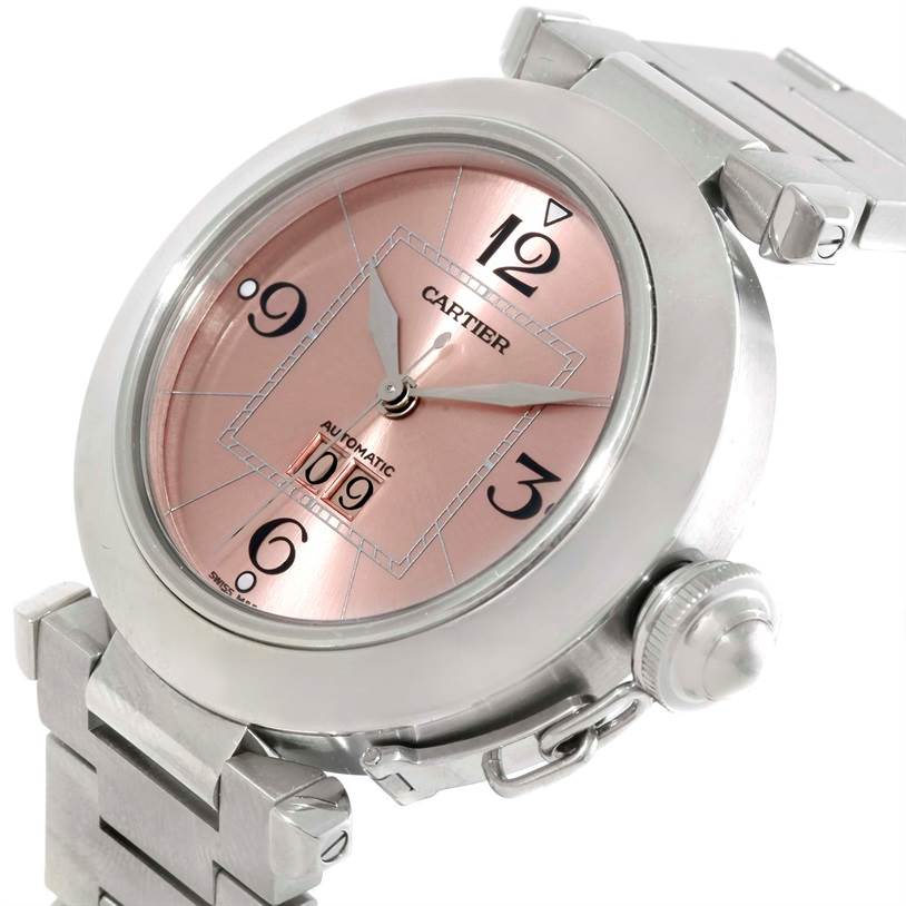 The Cartier Pasha 9791 Women
s Stainless Steel Pink Dial 9791 Women
s Stainless Steel Pink Dial watch is shown at a slight angle, highlighting the face, crown guard, and portions of the metal bracelet.