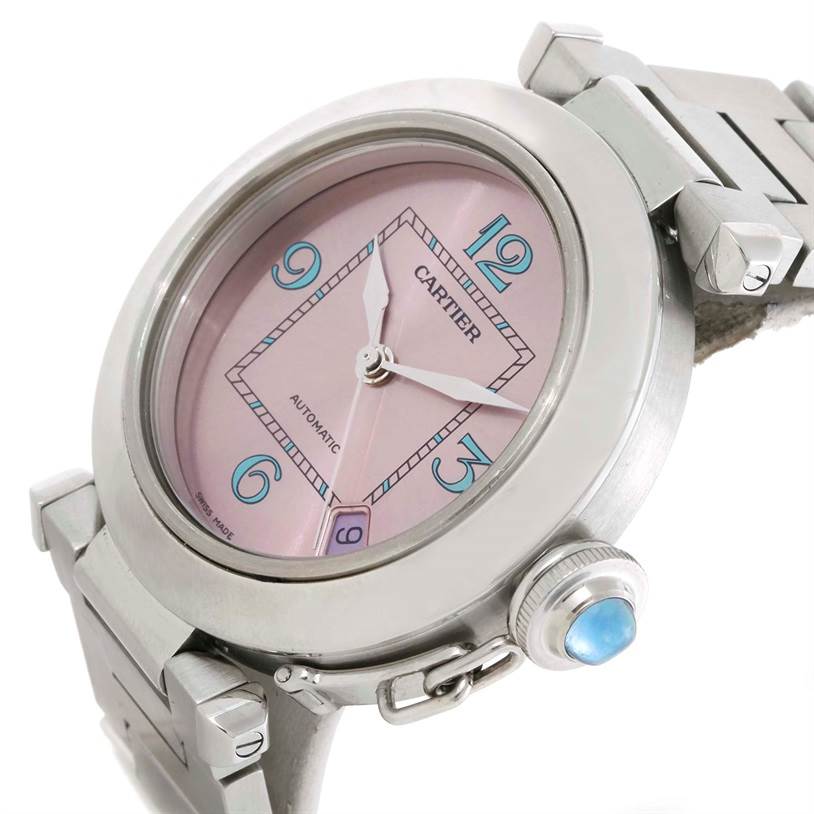 The Cartier Pasha W3108199 Women's Stainless Steel Pink Dial W3108199 Women's Stainless Steel Pink Dial watch is shown from a front angle, highlighting its pink dial, case, bracelet, and crown.