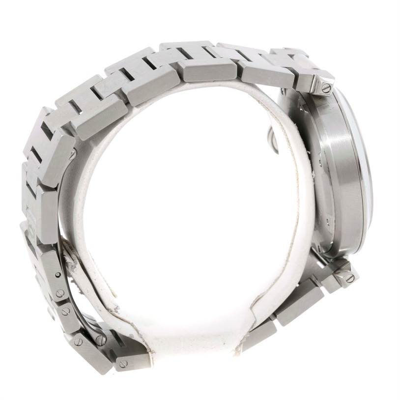 The image shows a side angle of the Cartier Pasha W31074M7 Women's Stainless Steel White Dial W31074M7 Women's Stainless Steel White Dial watch focusing on its metal band and case.