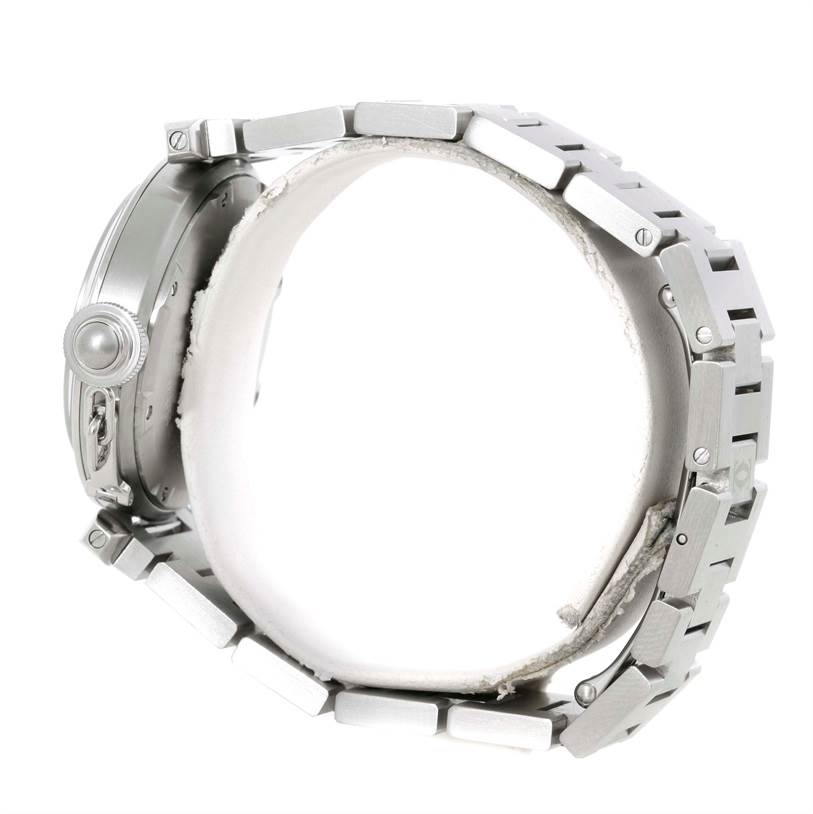 This side-angle view of the Cartier Pasha W31074M7 Women's Stainless Steel White Dial W31074M7 Women's Stainless Steel White Dial watch shows its bracelet, case, and crown.