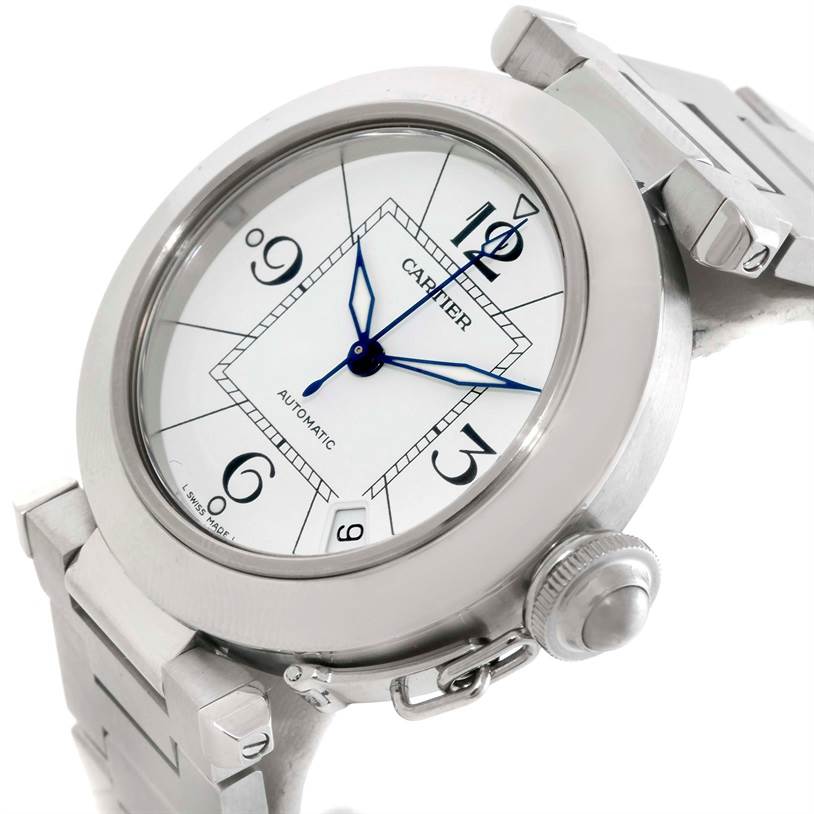 The image shows a Pasha model Cartier watch from an angled top view, highlighting its face, bezel, crown, and part of the bracelet.
