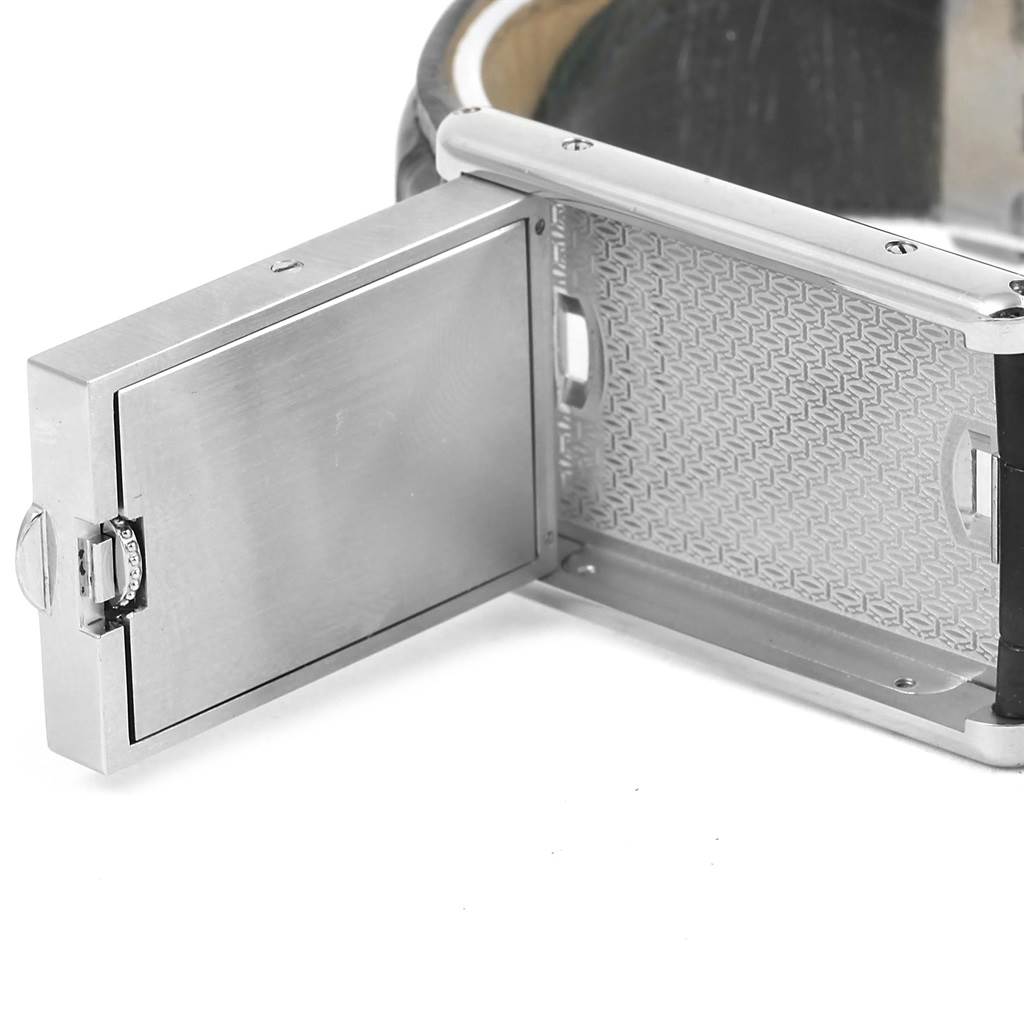The image shows the hinged back of a Cartier Tank Basculante 2522 Men's Stainless Steel Silver Dial 2522 Men's Stainless Steel Silver Dial watch case, displaying the internal mechanism and case design.