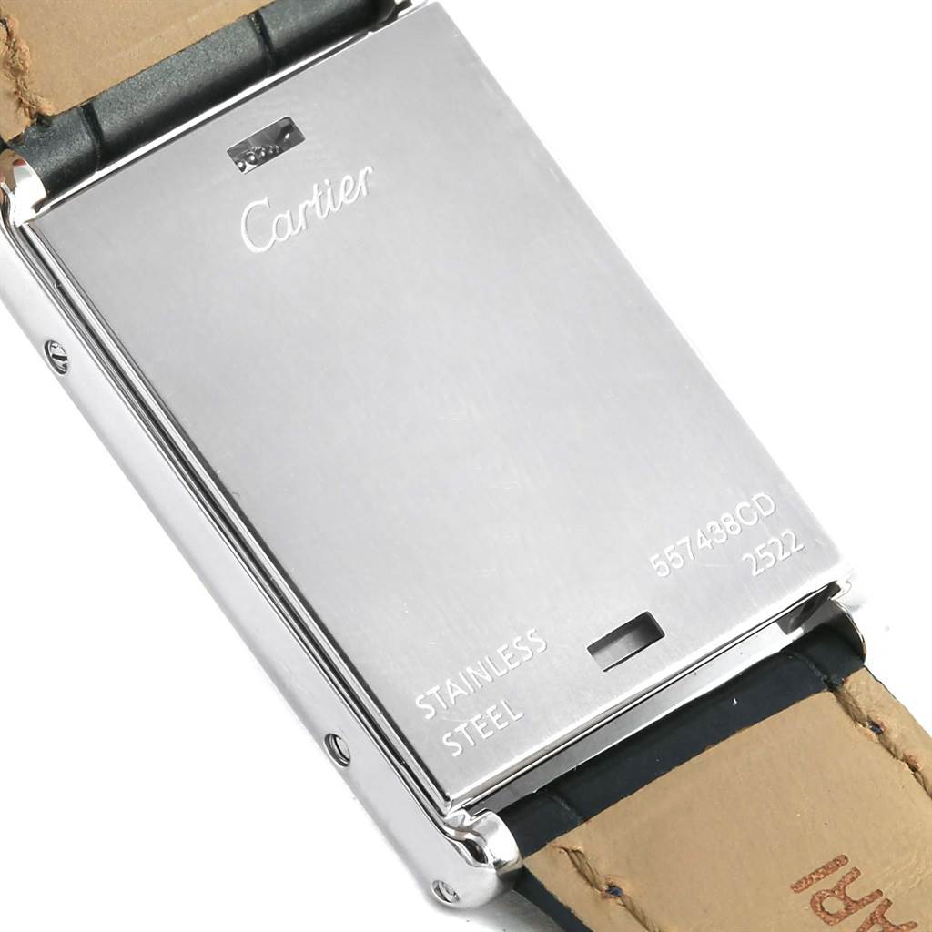 This image shows the stainless steel back case of a Cartier Tank Basculante 2522 Men's Stainless Steel Silver Dial 2522 Men's Stainless Steel Silver Dial watch, along with part of the leather strap.