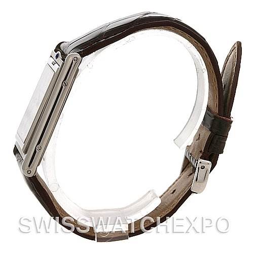 This is a side view of the Cartier Tank Basculante W1011358 Stainless Steel Silver Dial W1011358 Stainless Steel Silver Dial watch, highlighting its rectangular case, leather strap, and buckle.