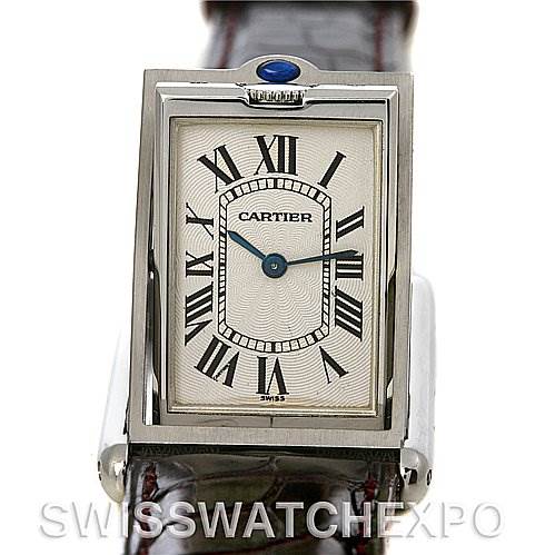 This image shows a front view of the Cartier Tank Basculante W1011358 Stainless Steel Silver Dial W1011358 Stainless Steel Silver Dial watch, highlighting its dial, Roman numerals, and blue jewel crown.