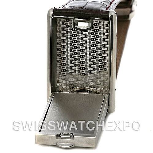 The image shows the open case back and hinge mechanism of a Cartier Tank Basculante W1011358 Stainless Steel Silver Dial W1011358 Stainless Steel Silver Dial watch, revealing the intricate inner structure.