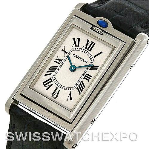 The image shows a Cartier Tank Basculante Stainless Steel Silver Dial Stainless Steel Silver Dial watch at a slight angle, displaying its face, crown, and part of the leather strap.