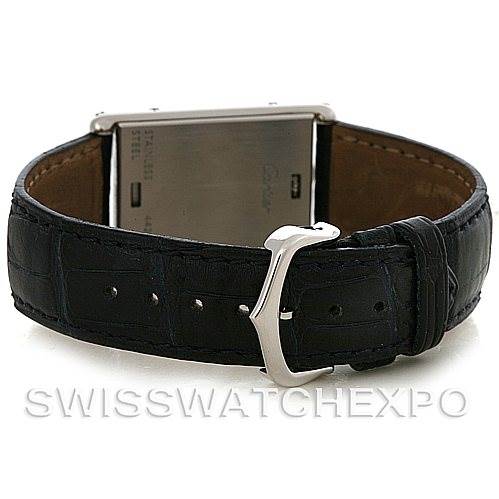 This image shows the back view of a Cartier Tank Basculante Stainless Steel Silver Dial Stainless Steel Silver Dial watch, focusing on its leather strap and buckle.