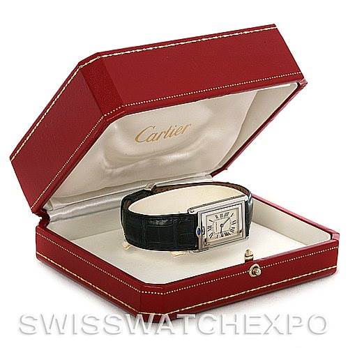 The Cartier Tank Basculante Stainless Steel Silver Dial Stainless Steel Silver Dial watch is shown in its red presentation box, angled open to display the watch face and leather strap.