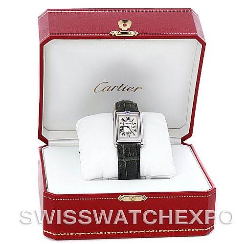 The Cartier Tank Basculante Men's Stainless Steel Silver Dial Men's Stainless Steel Silver Dial watch is displayed front-on inside an open red Cartier box with white interior.