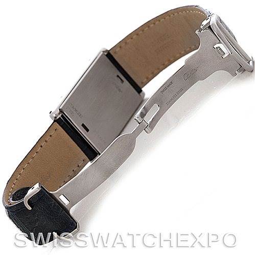 This image shows the underside view of a Cartier Tank Basculante Men's Stainless Steel Silver Dial Men's Stainless Steel Silver Dial watch, highlighting its clasp and part of the leather strap.