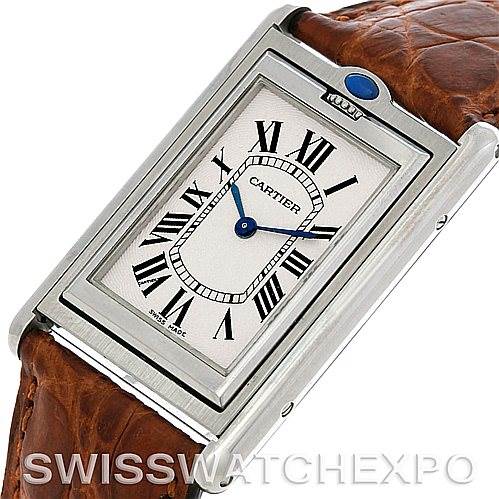 This image shows a Cartier Tank Basculante Men's Stainless Steel Silver Dial Men's Stainless Steel Silver Dial watch at a slight angle, highlighting its rectangular face, leather strap, and blue hands.