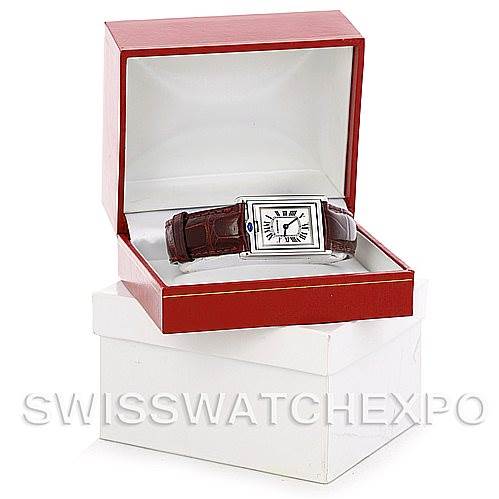 The image shows a Cartier Tank Basculante 2405 Women's Stainless Steel Silver Dial 2405 Women's Stainless Steel Silver Dial watch at a front angle, nestled in an open red jewelry box.