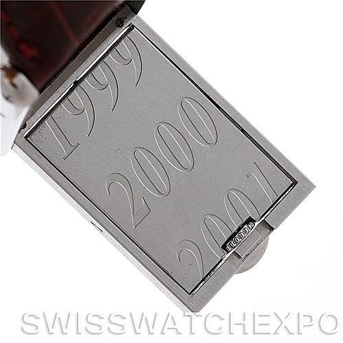 This image shows the back of a Cartier Tank Basculante 2405 Women's Stainless Steel Silver Dial 2405 Women's Stainless Steel Silver Dial watch with engravings of "1999," "2000," and "2001."