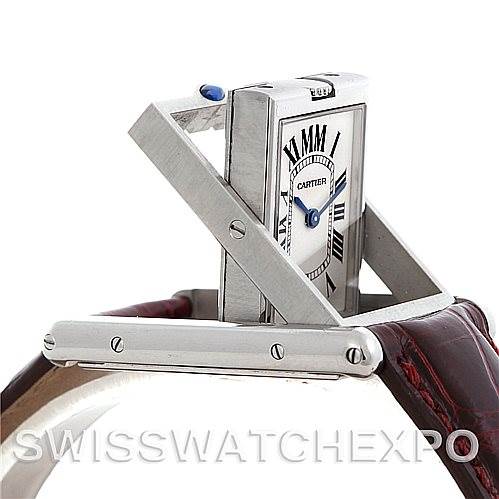 This image shows the Cartier Tank Basculante 2405 Women's Stainless Steel Silver Dial 2405 Women's Stainless Steel Silver Dial watch partially flipped within its case, emphasizing its unique reversible mechanism.