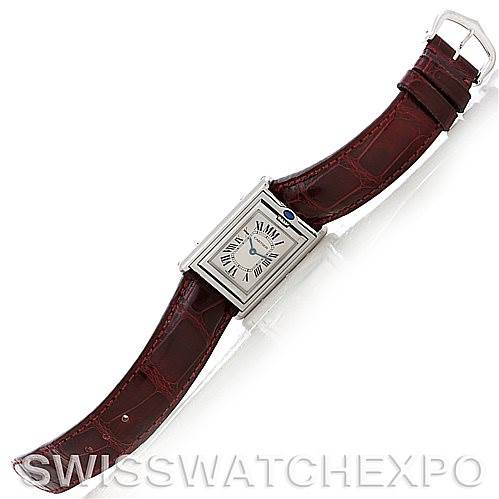 This image shows a Cartier Tank Basculante 2405 Women's Stainless Steel Silver Dial 2405 Women's Stainless Steel Silver Dial watch at an overhead angle, featuring its rectangular face and brown leather strap.