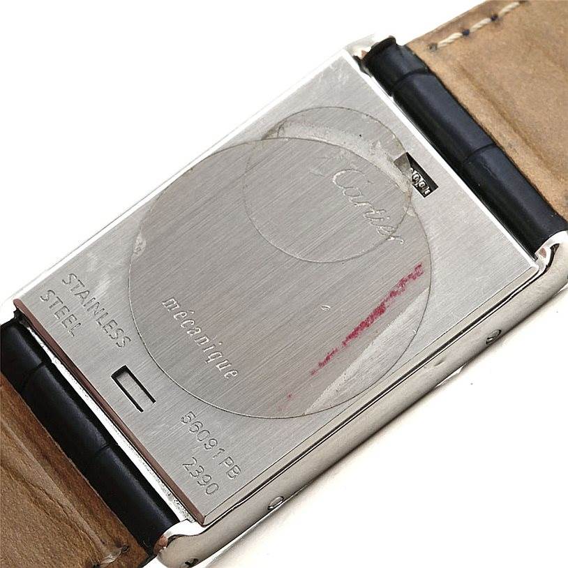 This image shows the back view of a Cartier Tank Basculante Men's Stainless Steel Silver Dial Men's Stainless Steel Silver Dial watch, displaying its case back and part of the strap.