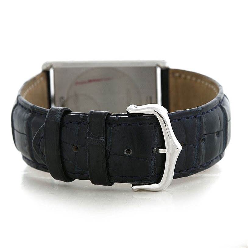 The image shows the back view of a Cartier Tank Basculante Men's Stainless Steel Silver Dial Men's Stainless Steel Silver Dial watch, highlighting its strap and buckle.