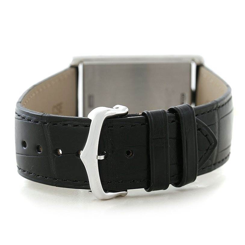 This image shows the backside of a Cartier Tank Basculante W1011358 Men's Stainless Steel Silver Dial W1011358 Men's Stainless Steel Silver Dial watch, focusing on its leather strap and buckle.