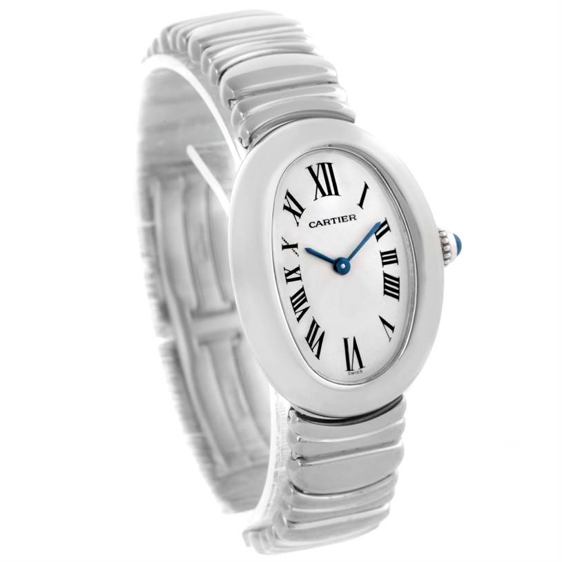 The Cartier Baignoire W15133L2 Women's White Gold Silver Dial W15133L2 Women's White Gold Silver Dial watch is shown at a three-quarter angle, displaying the oval dial, Roman numerals, blue hands, and a portion of the bracelet.