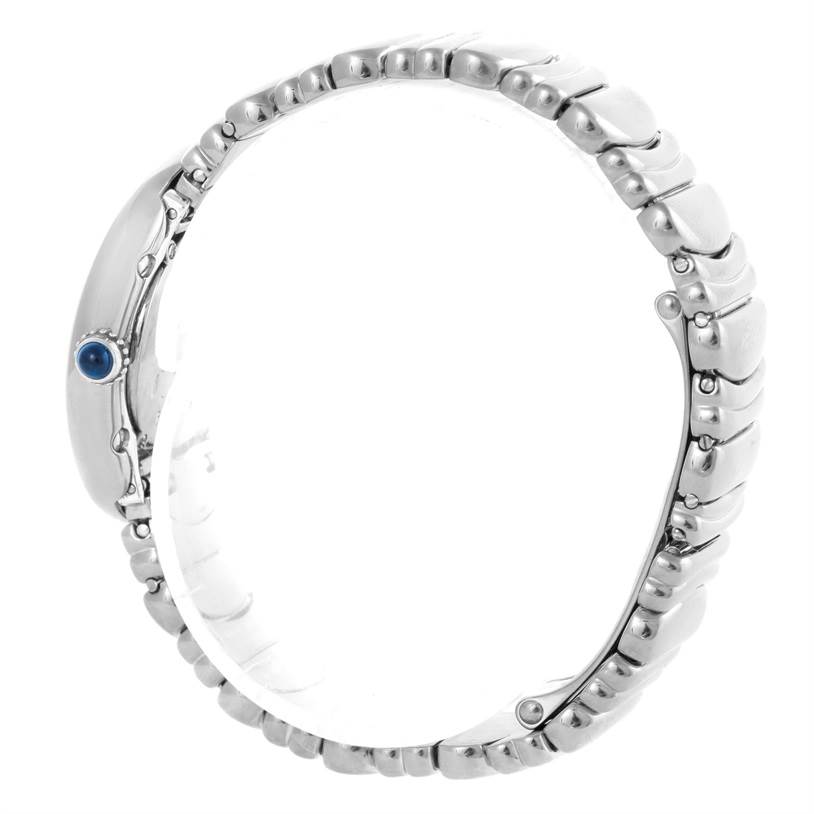 This image shows a side view of the Cartier Baignoire W15133L2 Women's White Gold Silver Dial W15133L2 Women's White Gold Silver Dial watch, highlighting its bracelet and crown with a blue gem.
