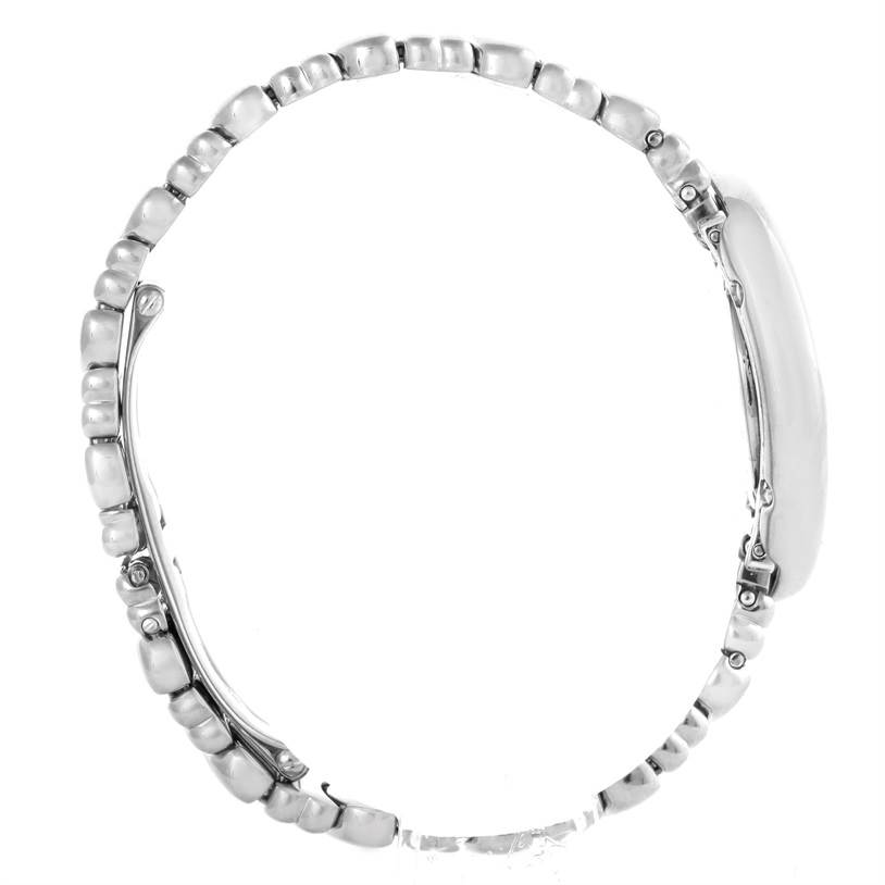 The Cartier Baignoire W15133L2 Women's White Gold Silver Dial W15133L2 Women's White Gold Silver Dial watch is shown from a side profile, highlighting its bracelet and side casing.