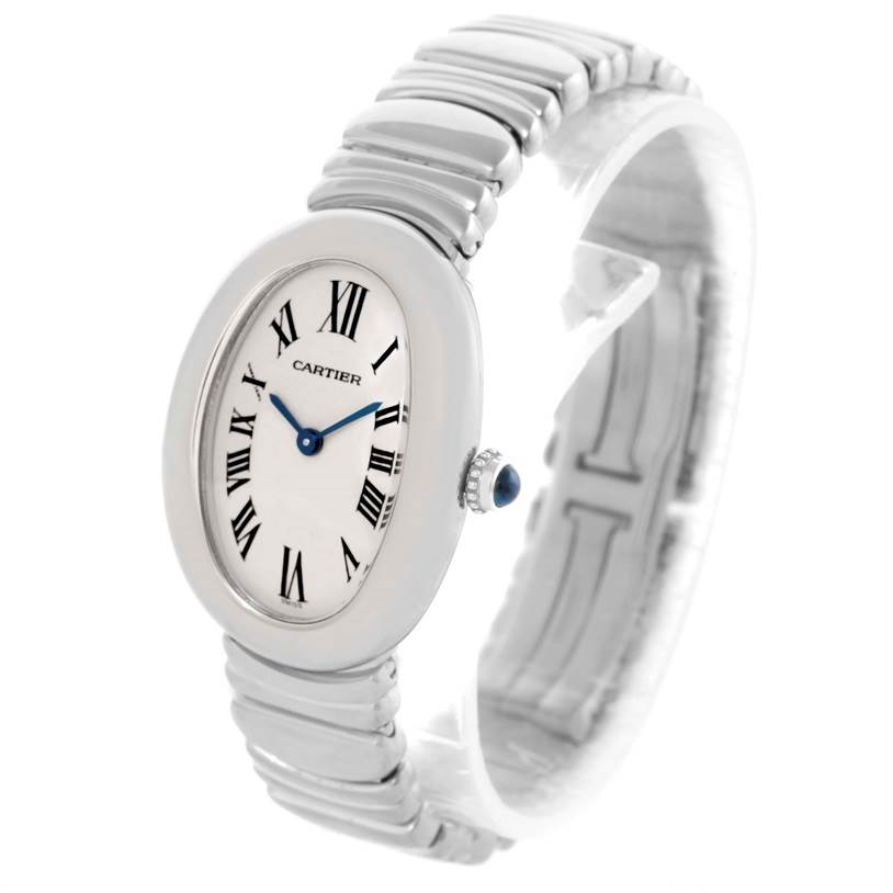 The Cartier Baignoire W15133L2 Women's White Gold Silver Dial W15133L2 Women's White Gold Silver Dial watch is shown at an angle highlighting its oval face, Roman numeral dial, and metal bracelet.