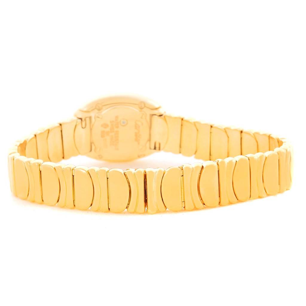 This image shows the back and linked band of a Cartier Baignoire WB5094D8 Women's Yellow Gold Silver Dial WB5094D8 Women's Yellow Gold Silver Dial watch displayed at an angle.