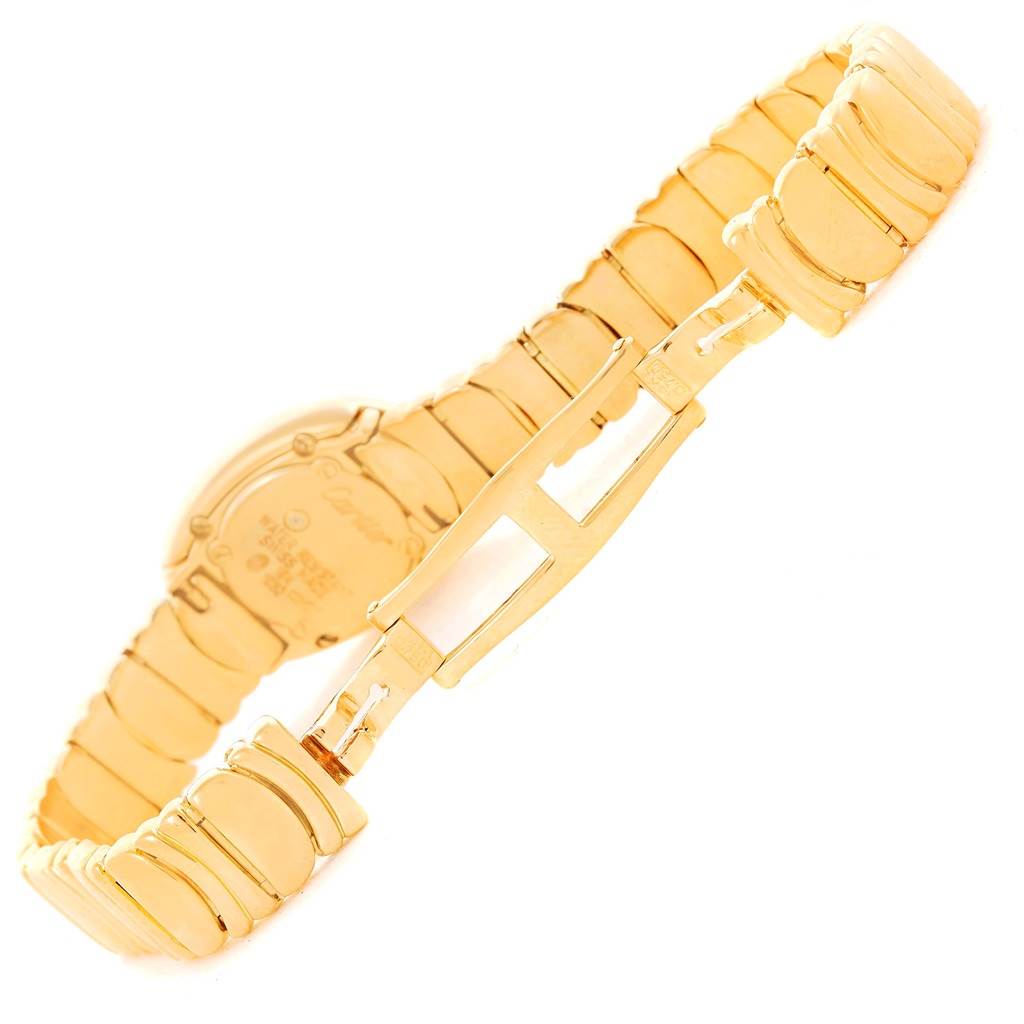 The image shows the backside of a Cartier Baignoire WB5094D8 Women's Yellow Gold Silver Dial WB5094D8 Women's Yellow Gold Silver Dial watch with a focus on its gold bracelet and clasp.