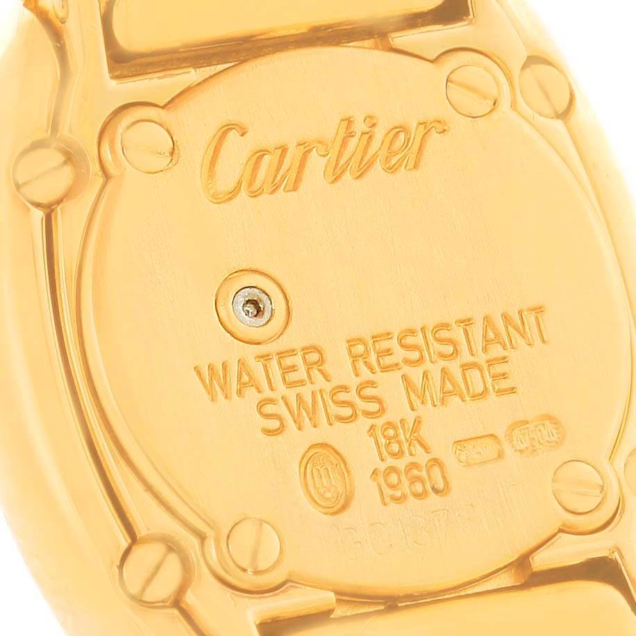 The image shows the back case of a Baignoire model by Cartier, highlighting its water resistance, Swiss make, and 18K gold details.
