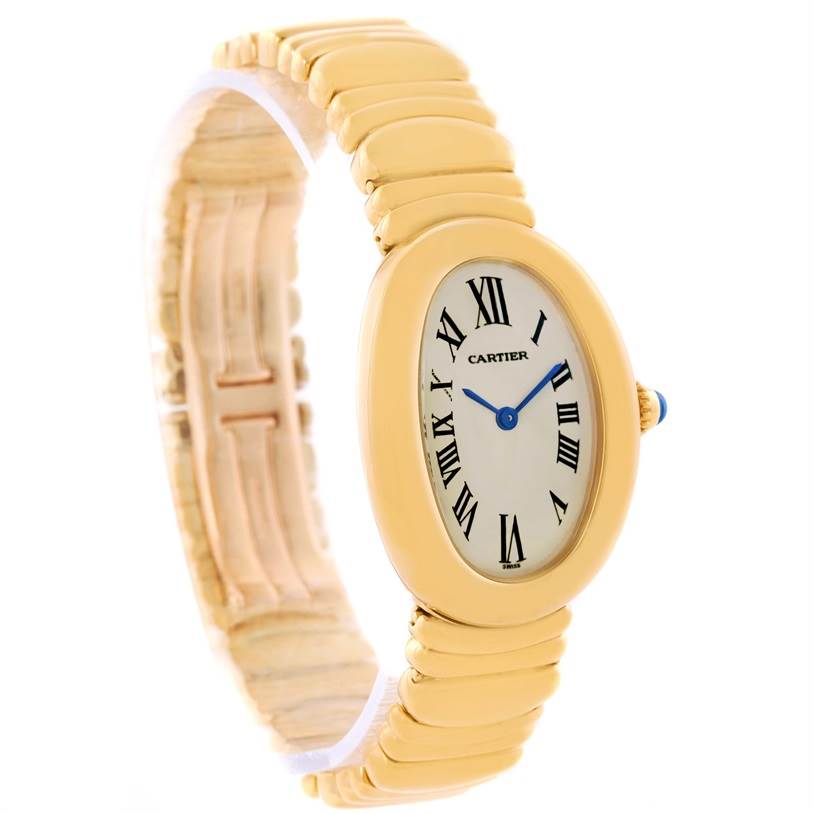 The image shows a Cartier Baignoire Women's Yellow Gold Silver Dial Women's Yellow Gold Silver Dial watch at a front-left angle displaying its elliptical dial, Roman numerals, and gold bracelet.