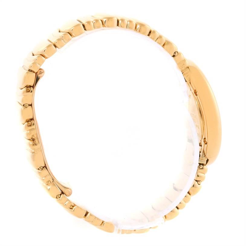 The Cartier Baignoire Women's Yellow Gold Silver Dial Women's Yellow Gold Silver Dial watch is shown from a side angle, highlighting the bracelet and the curvature of the case.