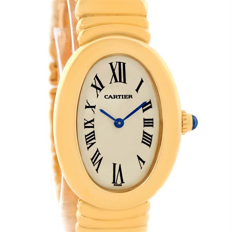 The image shows a front side view of a Cartier Baignoire Women's Yellow Gold Silver Dial Women's Yellow Gold Silver Dial watch, displaying the face, Roman numerals, and part of the gold bracelet.