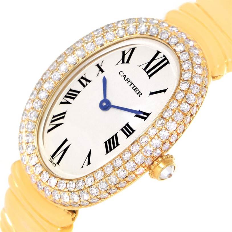 The image shows a close-up of a Cartier Baignoire 1950 Women
s Yellow Gold Silver Dial 1950 Women
s Yellow Gold Silver Dial watch face with a diamond-studded bezel and yellow gold case.