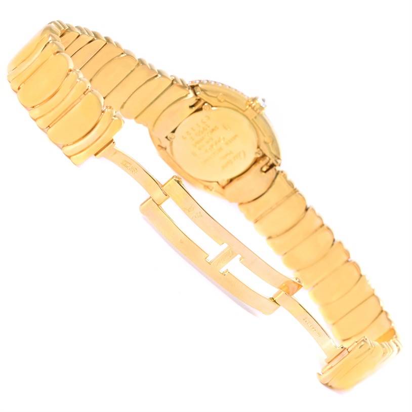The image shows the back and strap of a Cartier Baignoire 1950 Women
s Yellow Gold Silver Dial 1950 Women
s Yellow Gold Silver Dial watch from an angled side view.