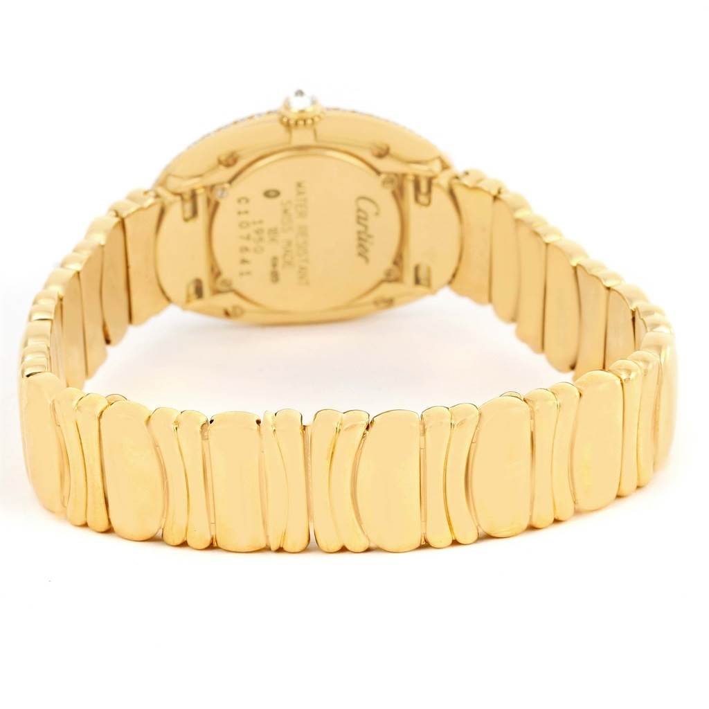 The image shows the back view of the Cartier Baignoire 1950 Women's Yellow Gold Silver Dial 1950 Women's Yellow Gold Silver Dial watch, highlighting its gold bracelet and case back.