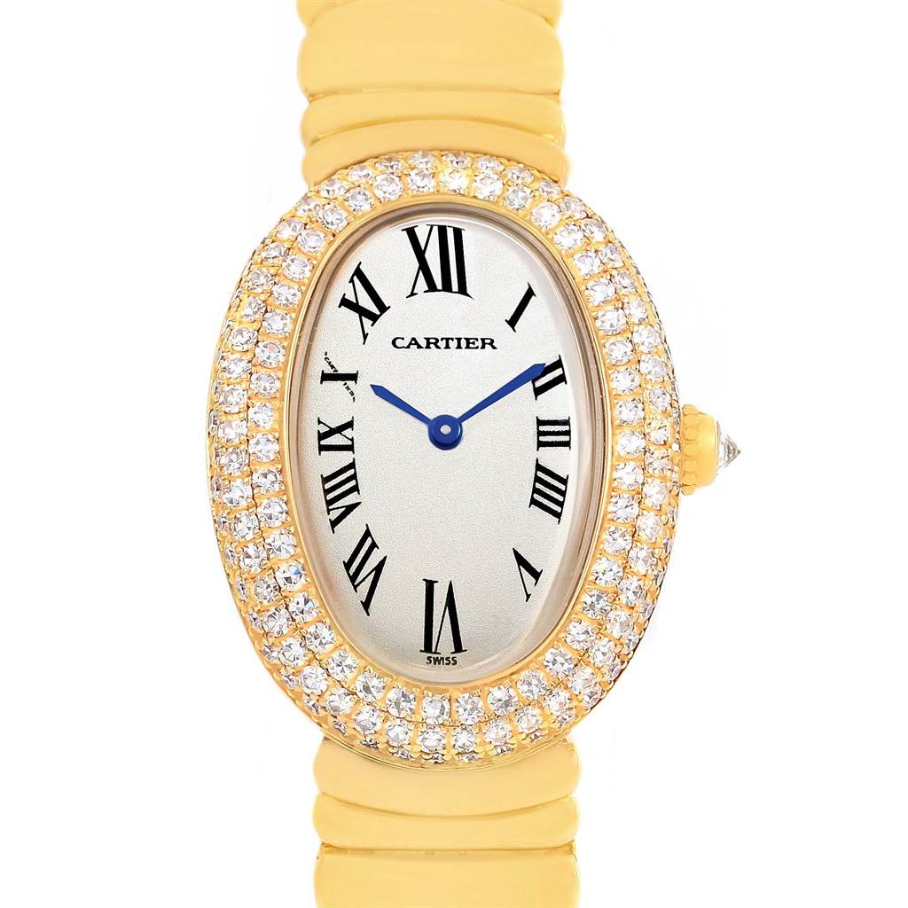 This is a front view of a Cartier Baignoire 1950 Women's Yellow Gold Silver Dial 1950 Women's Yellow Gold Silver Dial watch, showing the oval face, diamond bezel, Roman numerals, and gold strap.