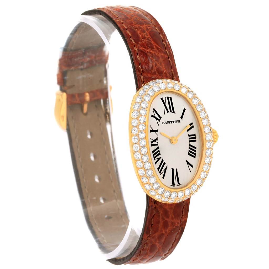 This Cartier Baignoire 1954 Women
s Yellow Gold Silver Dial 1954 Women
s Yellow Gold Silver Dial watch is shown at an angled side view, displaying the front dial, bezel, and leather strap.