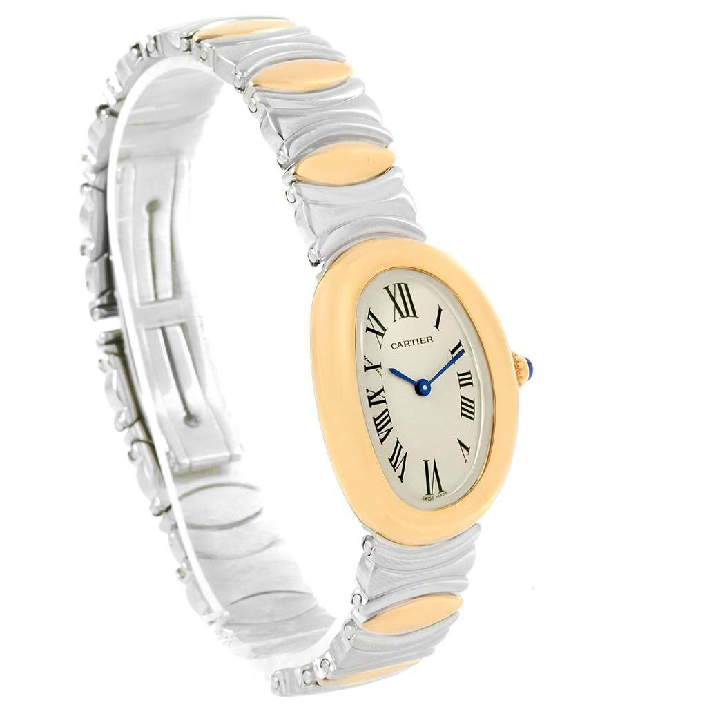 The image shows a side angle view of the Cartier Baignoire W15045D8 Women's Yellow Gold Silver Dial W15045D8 Women's Yellow Gold Silver Dial model watch, displaying its oval face and unique band design.