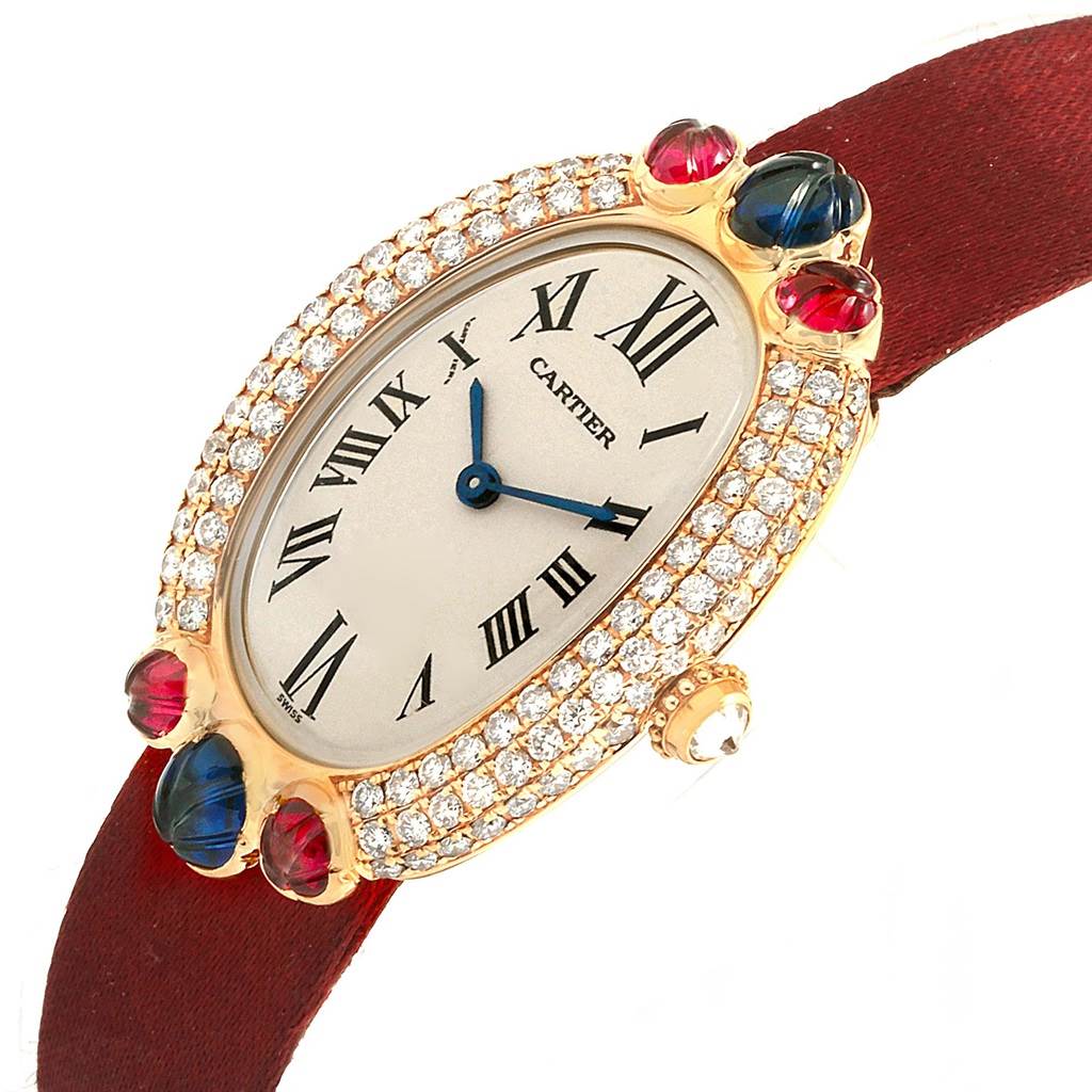 The Cartier Baignoire 1950 Women's Yellow Gold Silver Dial 1950 Women's Yellow Gold Silver Dial watch is shown at a slight angle, highlighting its diamond-encrusted oval bezel, Roman numeral dial, and red strap.