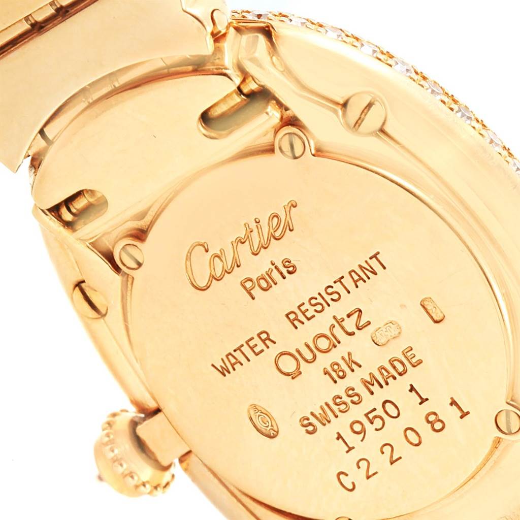 The image shows the back and part of the strap of the Cartier Baignoire 1950 Women's Yellow Gold Silver Dial 1950 Women's Yellow Gold Silver Dial watch, highlighting its markings and material details.