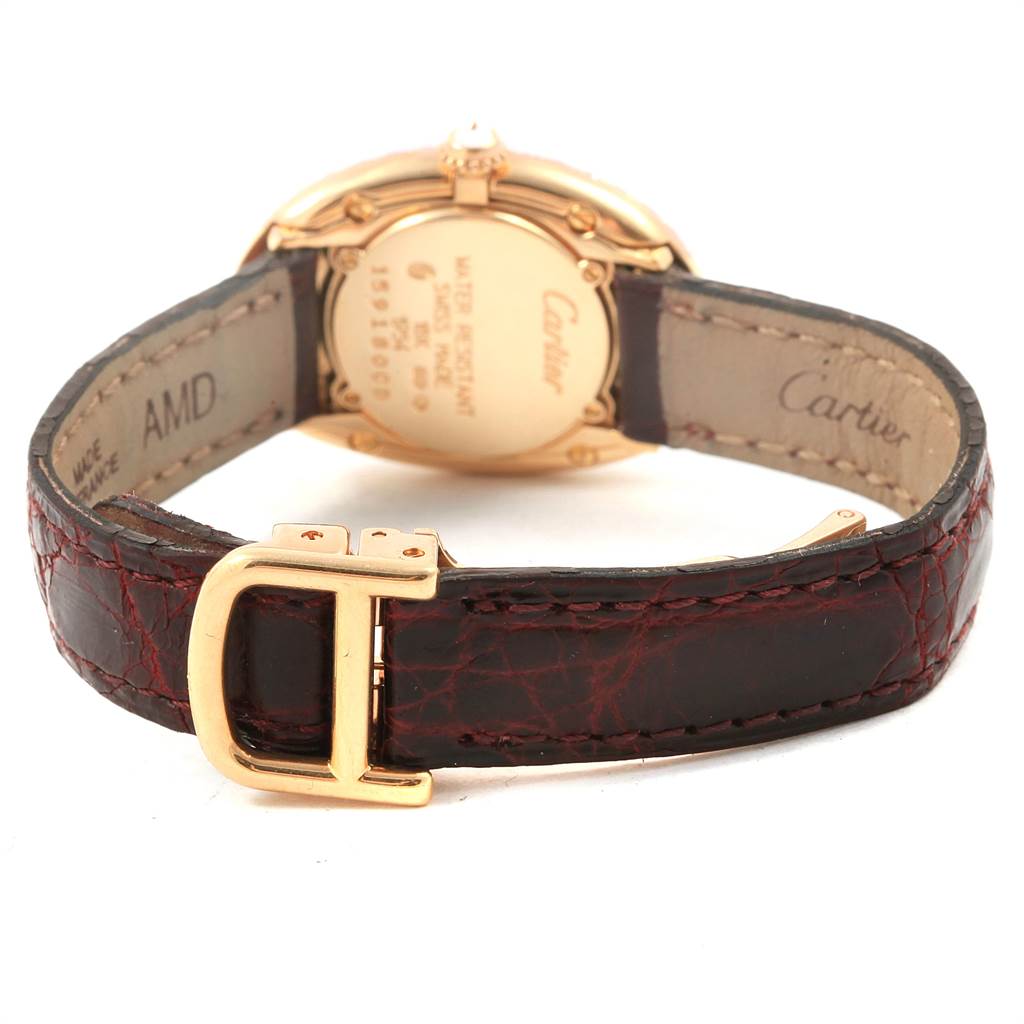 This image shows the back view of a Cartier Baignoire 1954 Women's Yellow Gold Silver Dial 1954 Women's Yellow Gold Silver Dial watch, highlighting the leather strap and gold buckle.