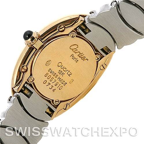 The image shows the back casing and part of the bracelet of the Cartier Baignoire W15045D8 Women
s Yellow Gold Silver Dial W15045D8 Women
s Yellow Gold Silver Dial watch, displaying its inscription details.