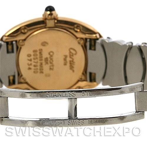 The image shows the back case of the Cartier Baignoire W15045D8 Women
s Yellow Gold Silver Dial W15045D8 Women
s Yellow Gold Silver Dial watch and the stainless steel clasp of its metal bracelet.