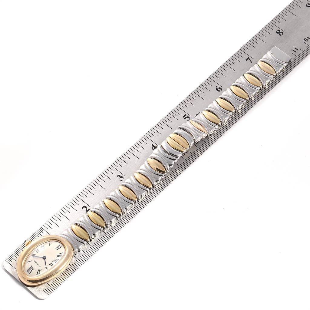 The image shows a Cartier Baignoire W15045D8 Women's Yellow Gold Silver Dial W15045D8 Women's Yellow Gold Silver Dial watch with its bracelet laid parallel to a ruler for scale.