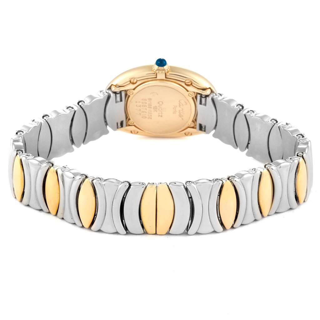 The Cartier Baignoire W15045D8 Women's Yellow Gold Silver Dial W15045D8 Women's Yellow Gold Silver Dial watch is shown from the back, displaying its case and metallic two-toned bracelet.