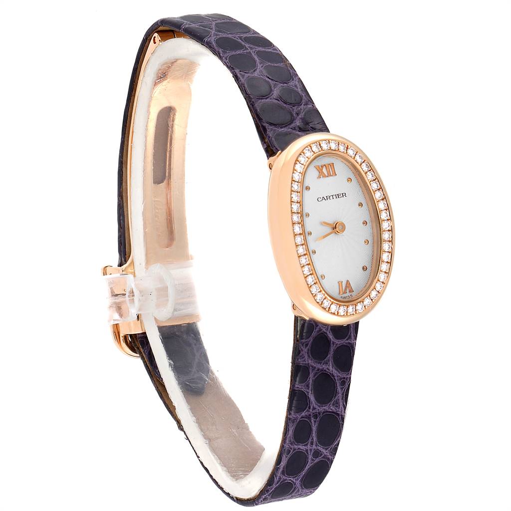 The Cartier Baignoire 2333 Women's Rose Gold Silver Dial 2333 Women's Rose Gold Silver Dial watch is shown at a slight angle, highlighting its oval face, diamond bezel, and black leather strap.