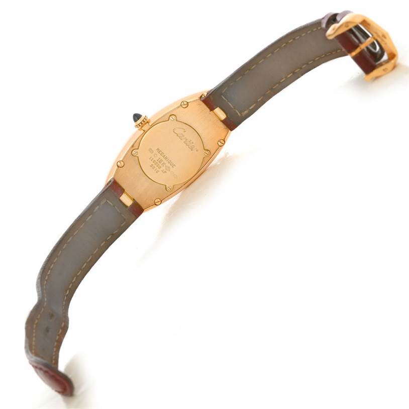 This image shows the back of a Cartier Baignoire Women's Rose Gold Silver Dial Women's Rose Gold Silver Dial watch, focusing on the case back and straps.