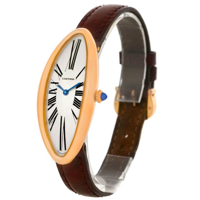 The Cartier Baignoire Women's Rose Gold Silver Dial Women's Rose Gold Silver Dial watch is shown at a slight angle, highlighting its oval face, roman numerals, and leather strap.